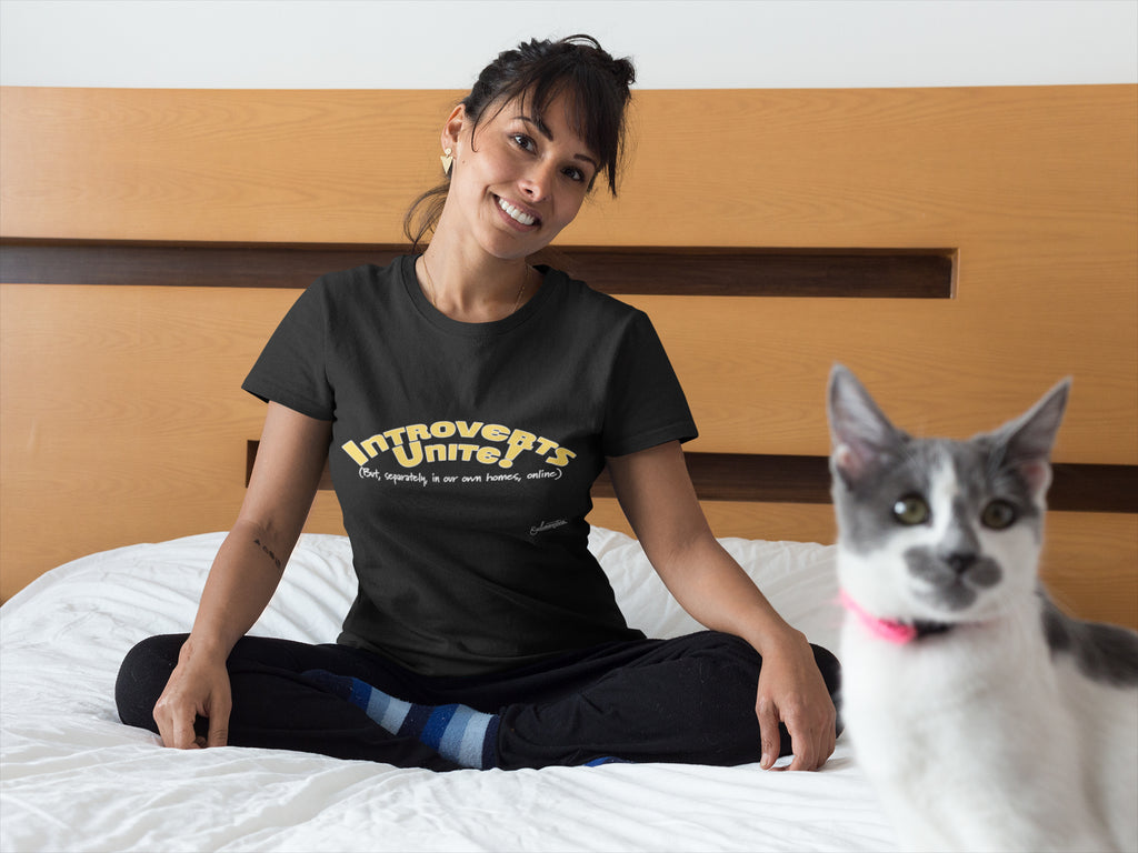 Women in bedroom wearing Introverts Unite tee with cat